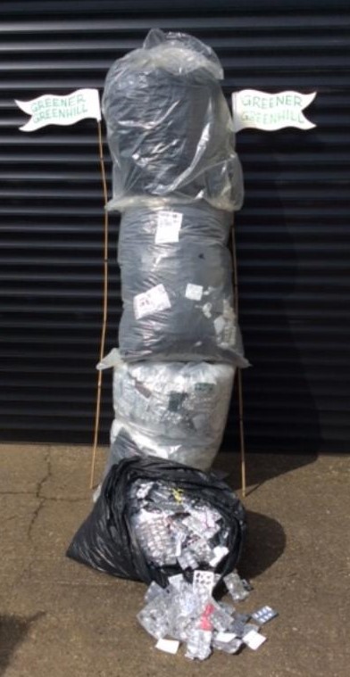 4 large bags of blister packs and 2 Greener Greenhill flags.